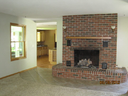 13491 East Bethel Road Rochelle, IL 61068 - Photo 7 of 11 a view of a livingroom with a fireplace