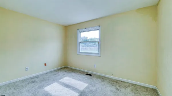 a view of a livingroom with wooden floor
