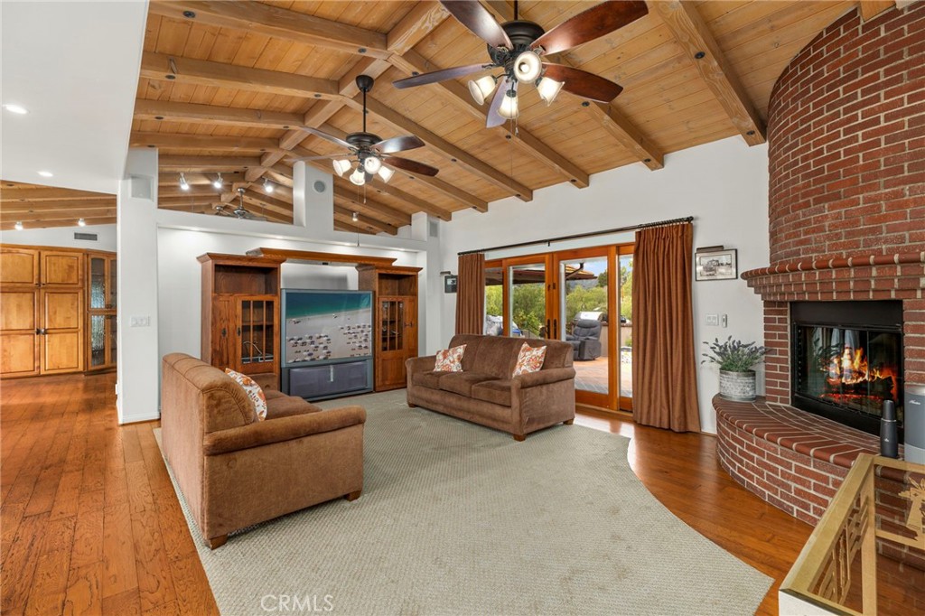 43991 John Warner Road Temecula, CA 92592 - Photo 11 of 39 a living room with furniture and a fireplace