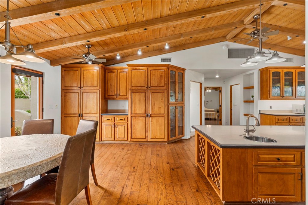 43991 John Warner Road Temecula, CA 92592 - Photo 14 of 39 a dining room with stainless steel appliances wooden floors and large window