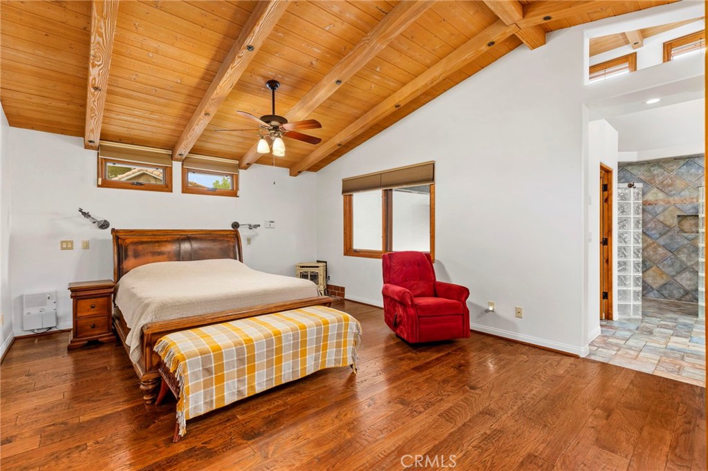 43991 John Warner Road Temecula, CA 92592 - Photo 18 of 39 a bedroom with a bed and wooden floor