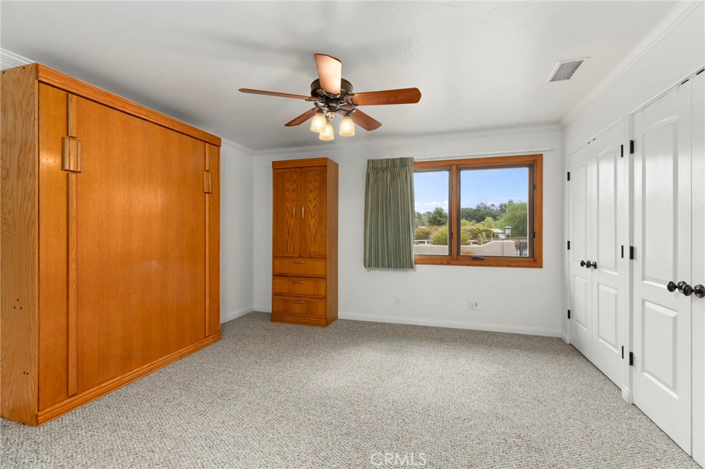 43991 John Warner Road Temecula, CA 92592 - Photo 22 of 39 an empty room with windows and fan