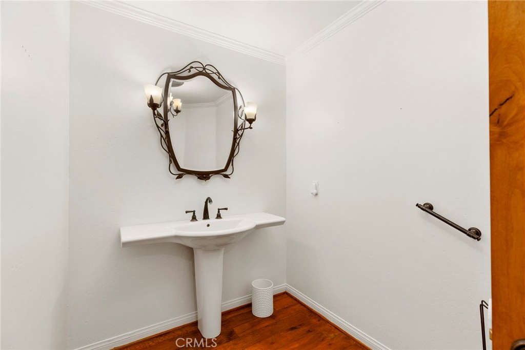 43991 John Warner Road Temecula, CA 92592 - Photo 28 of 39 a bathroom with a sink and a mirror