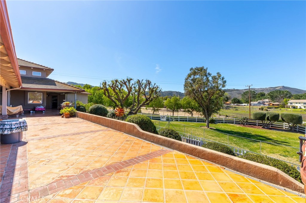 43991 John Warner Road Temecula, CA 92592 - Photo 32 of 39 a swimming pool with outdoor seating and yard