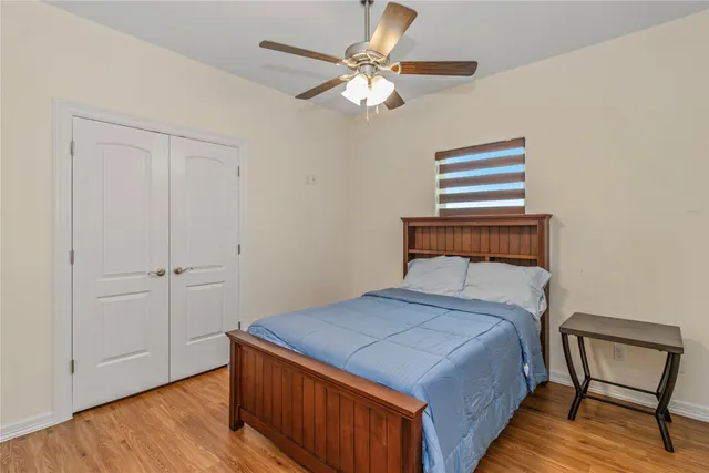 a bedroom with a bed and a dresser