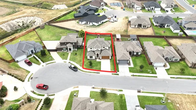 an aerial view of a house a swimming pool and outdoor space