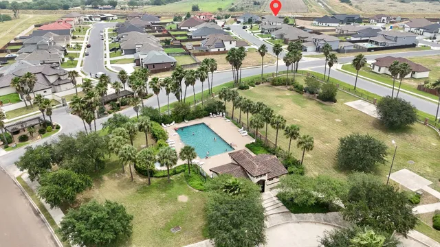 an aerial view of residential houses with outdoor space