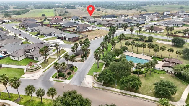 an aerial view of residential houses with outdoor space