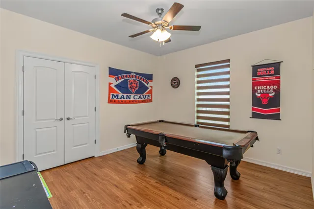 a view of a room with furniture and wooden floor