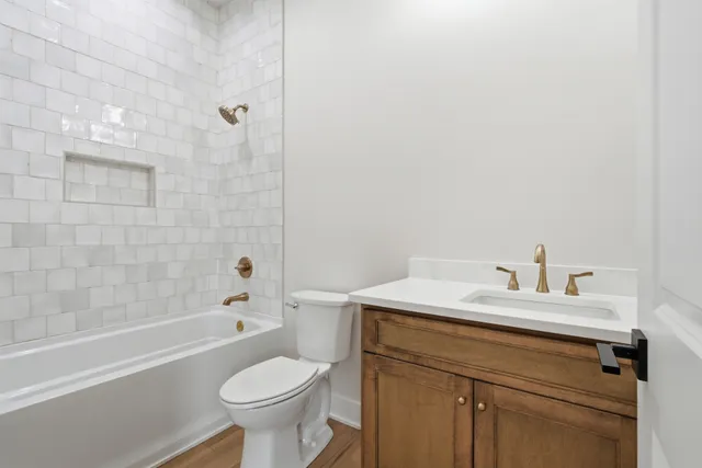 a bathroom with a sink a toilet and a bathtub