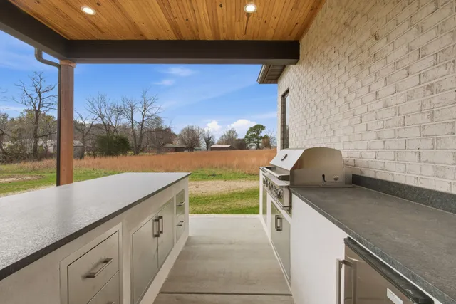 a kitchen with a sink and a stove