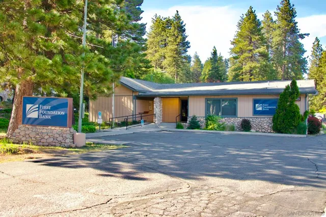 a front view of a house with parking