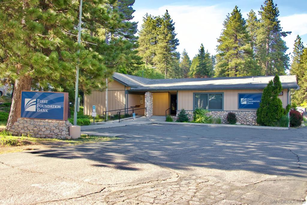 32065 Hunsaker Way Running Springs, CA 92382 - Photo 16 of 39 a front view of a house with a yard and a garage