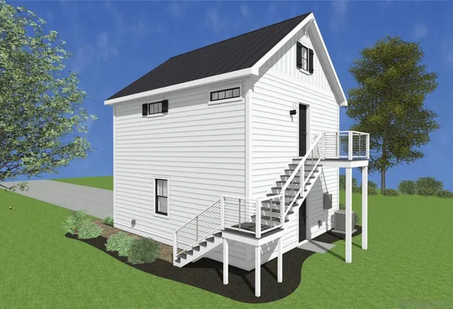 a living room with furniture and view of kitchen