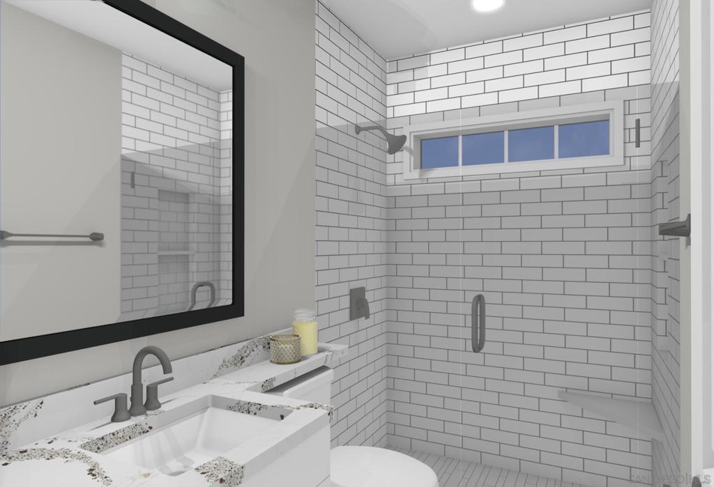 32065 Hunsaker Way Running Springs, CA 92382 - Photo 37 of 39 a bathroom with a sink a toilet and mirror