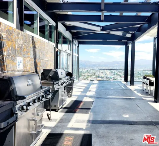 a view of a chairs and table in the balcony