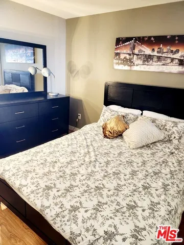 a bedroom with a bed and lamp