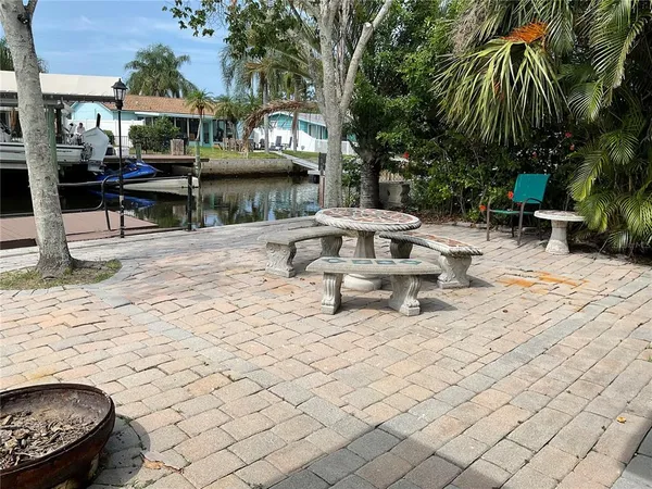 a view of a swimming pool with chairs