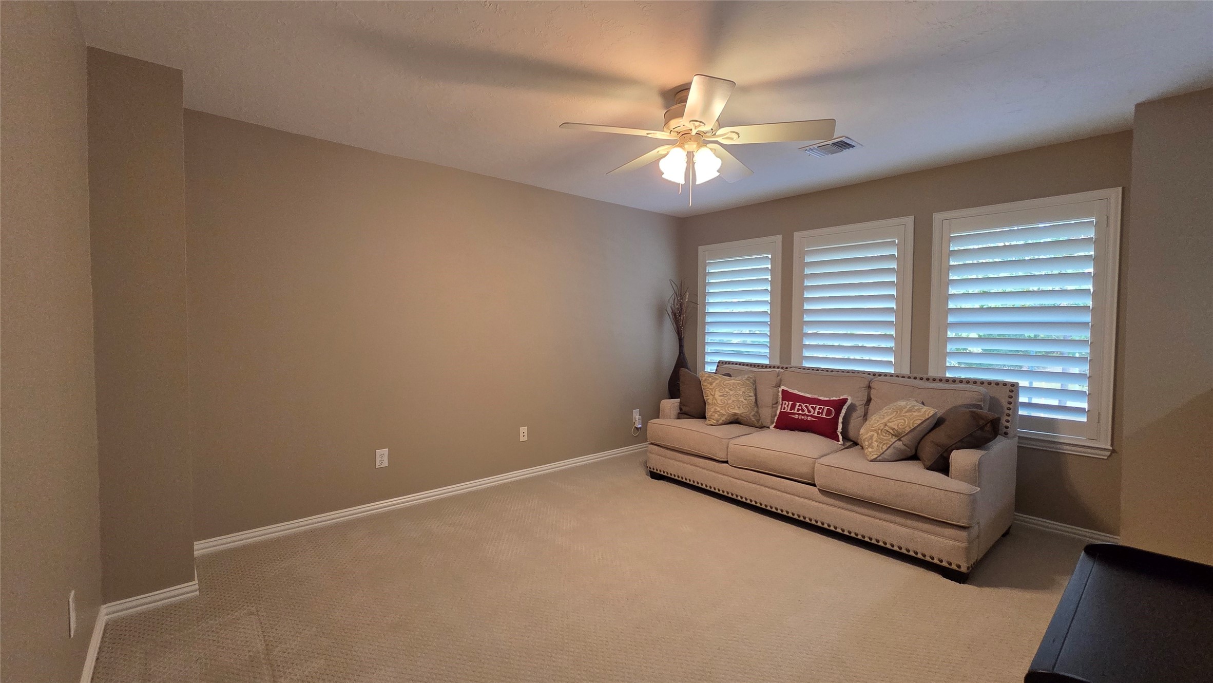 10310 Pitcataway Drive Spring, TX 77379 - Photo 26 of 37 a living room with furniture and a chandelier