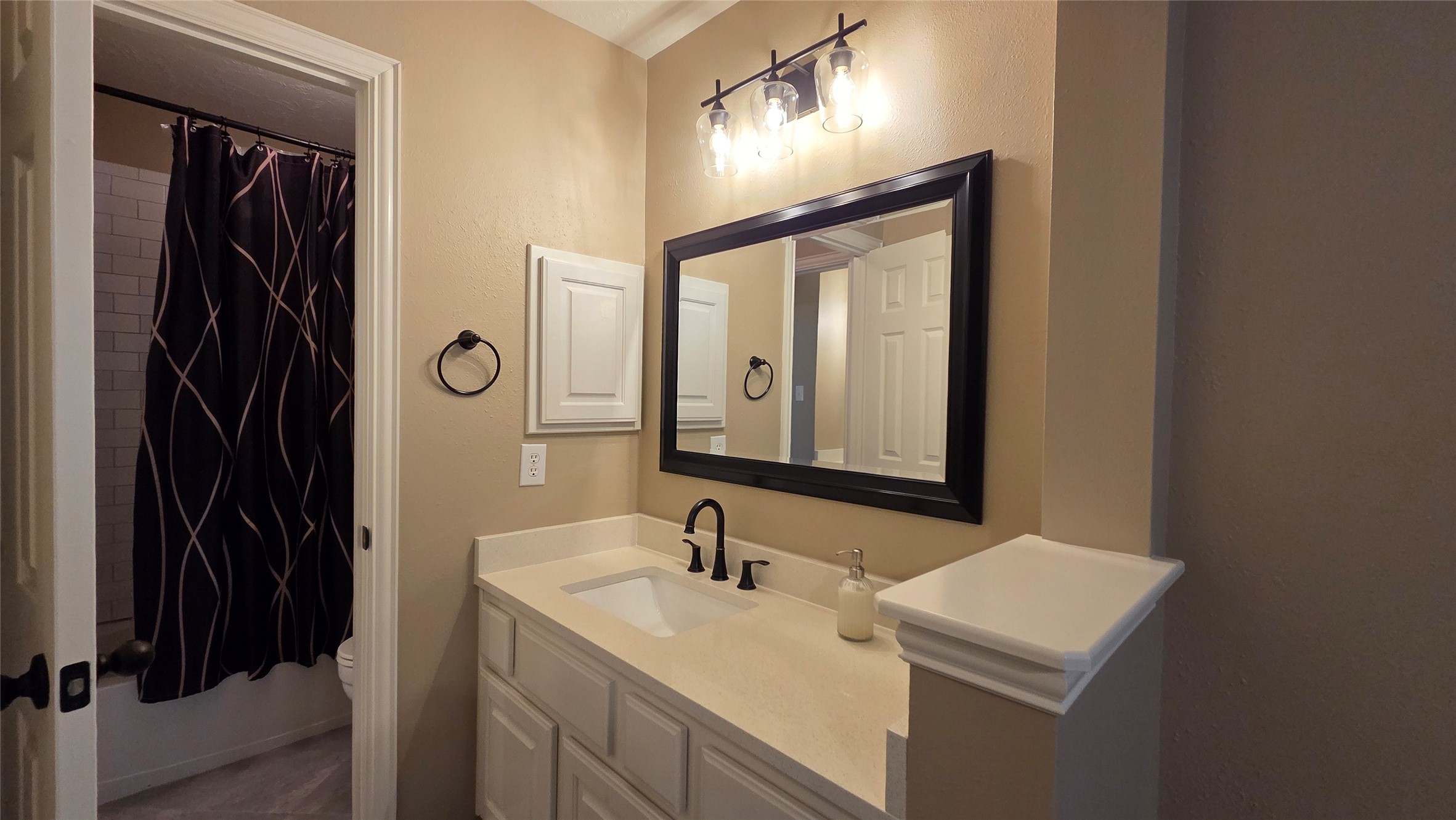 10310 Pitcataway Drive Spring, TX 77379 - Photo 29 of 37 a bathroom with a sink and a mirror