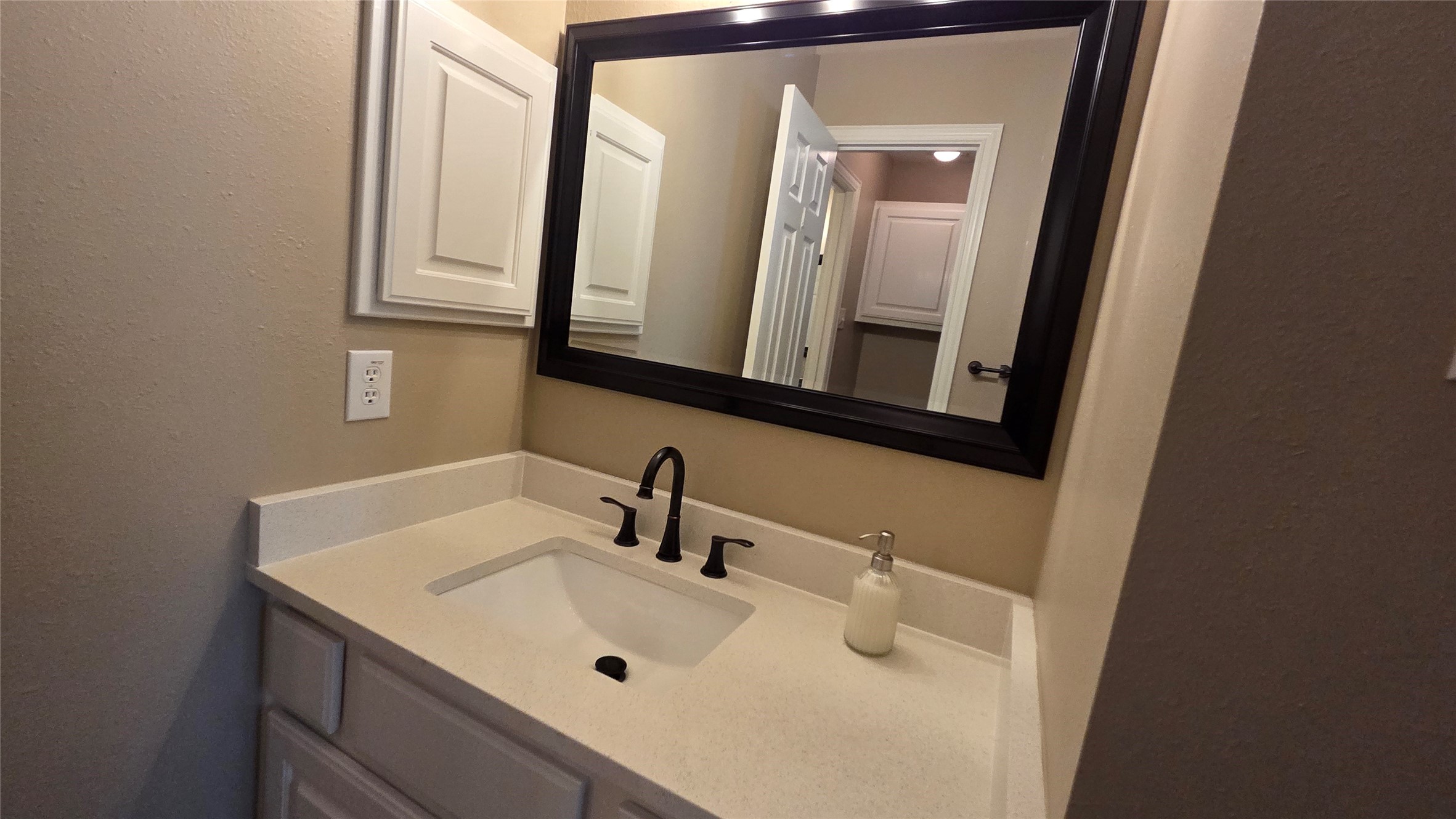 10310 Pitcataway Drive Spring, TX 77379 - Photo 30 of 37 a bathroom with a sink and a mirror