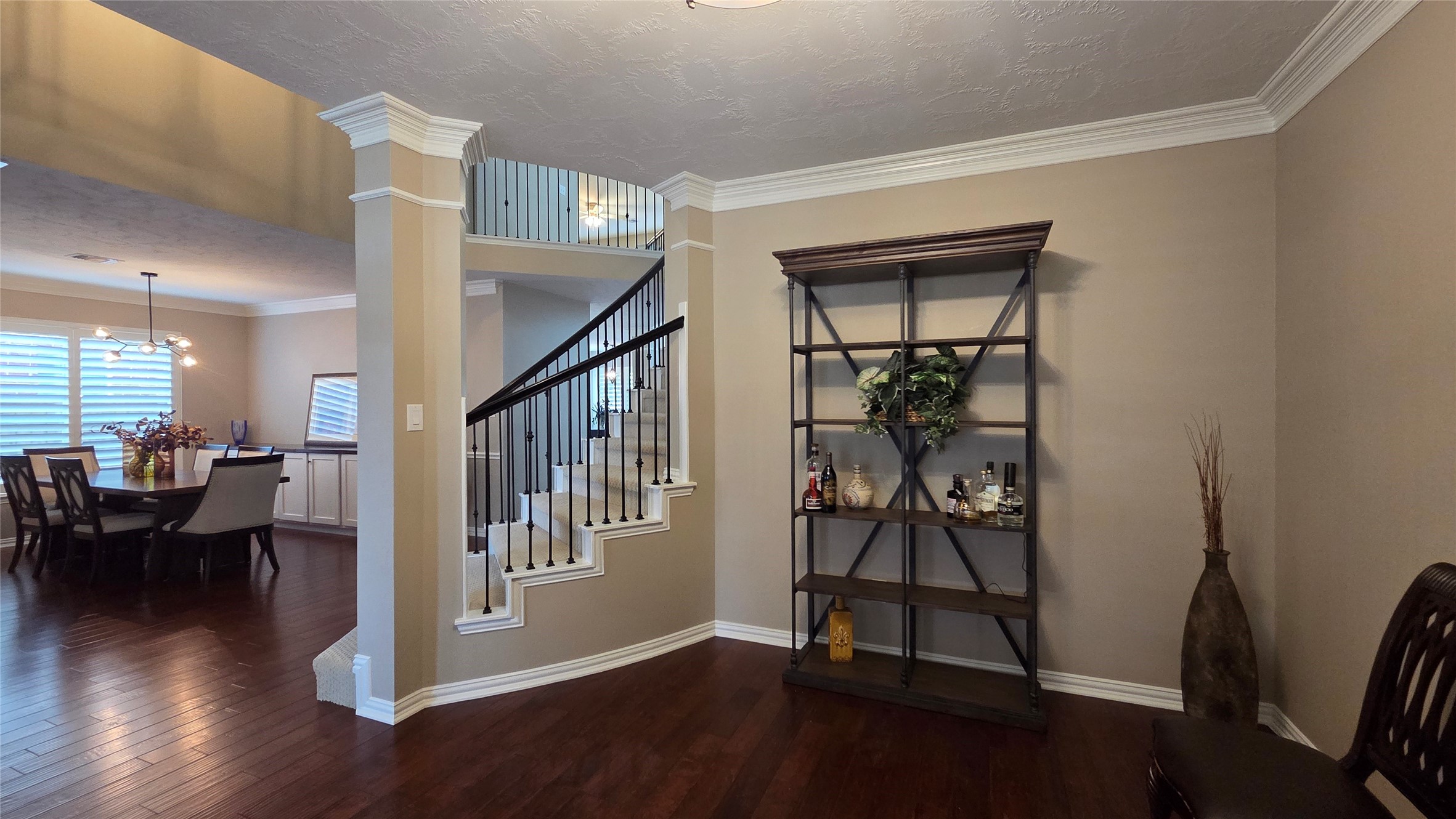 10310 Pitcataway Drive Spring, TX 77379 - Photo 9 of 37 a view of a hallway with wooden floor and dining room