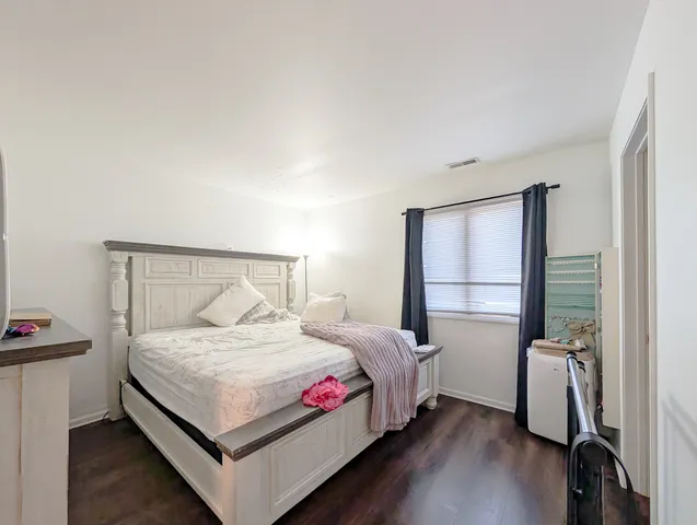 a bathroom with a shower curtain and a toilet