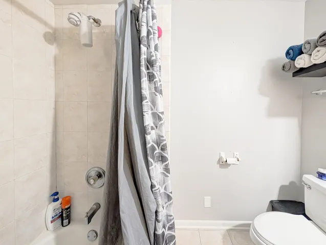 a bathroom with a sink double vanity and a toilet