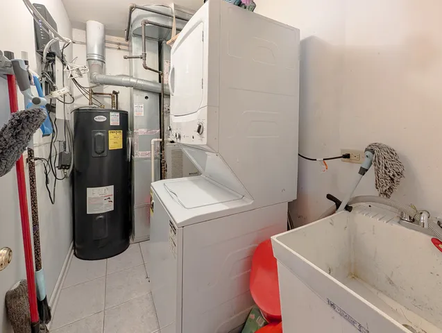 a bathroom with a sink vanity mirror and tub