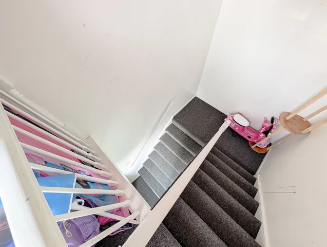 a view of a hallway with windows
