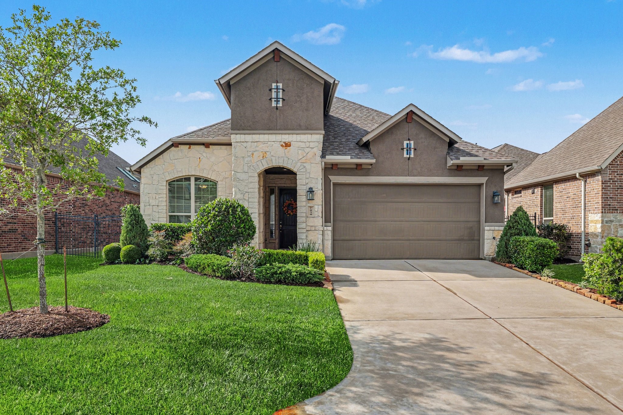 a front view of a house with a yard