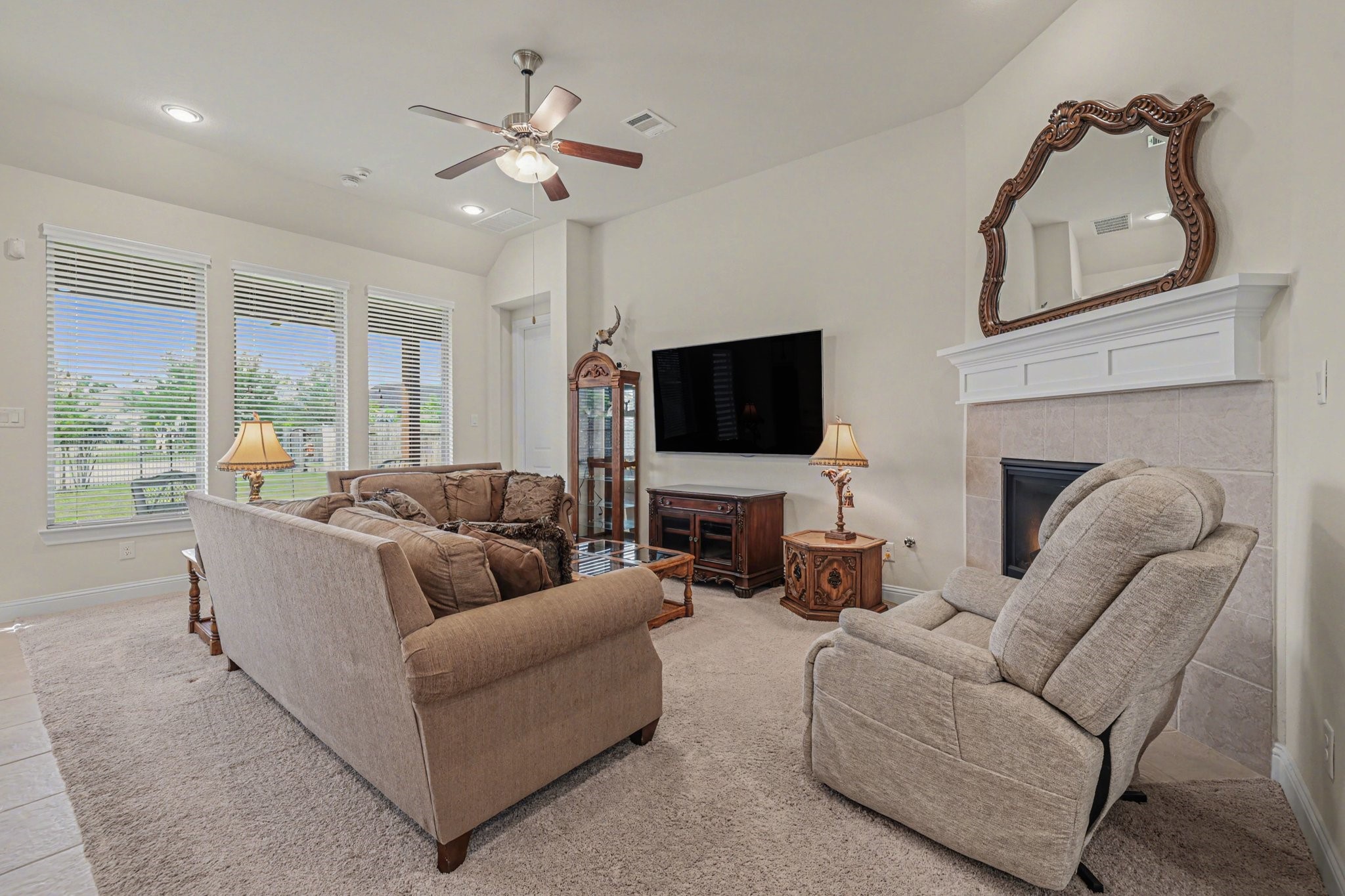 7434 Kearney Hill Lane Spring, TX 77389 - Photo 10 of 36 a living room with furniture and a flat screen tv