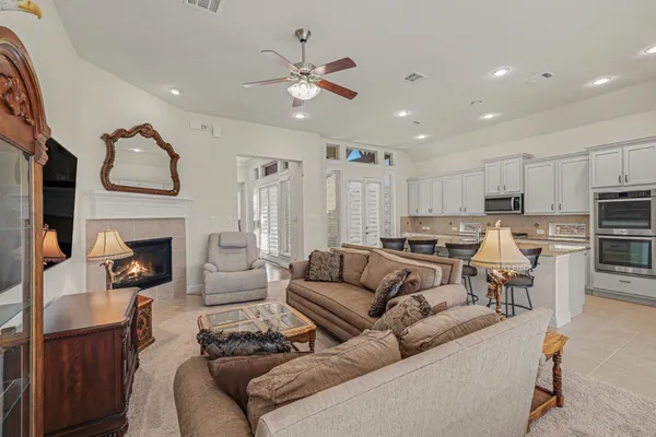a bedroom with furniture and a flat screen tv