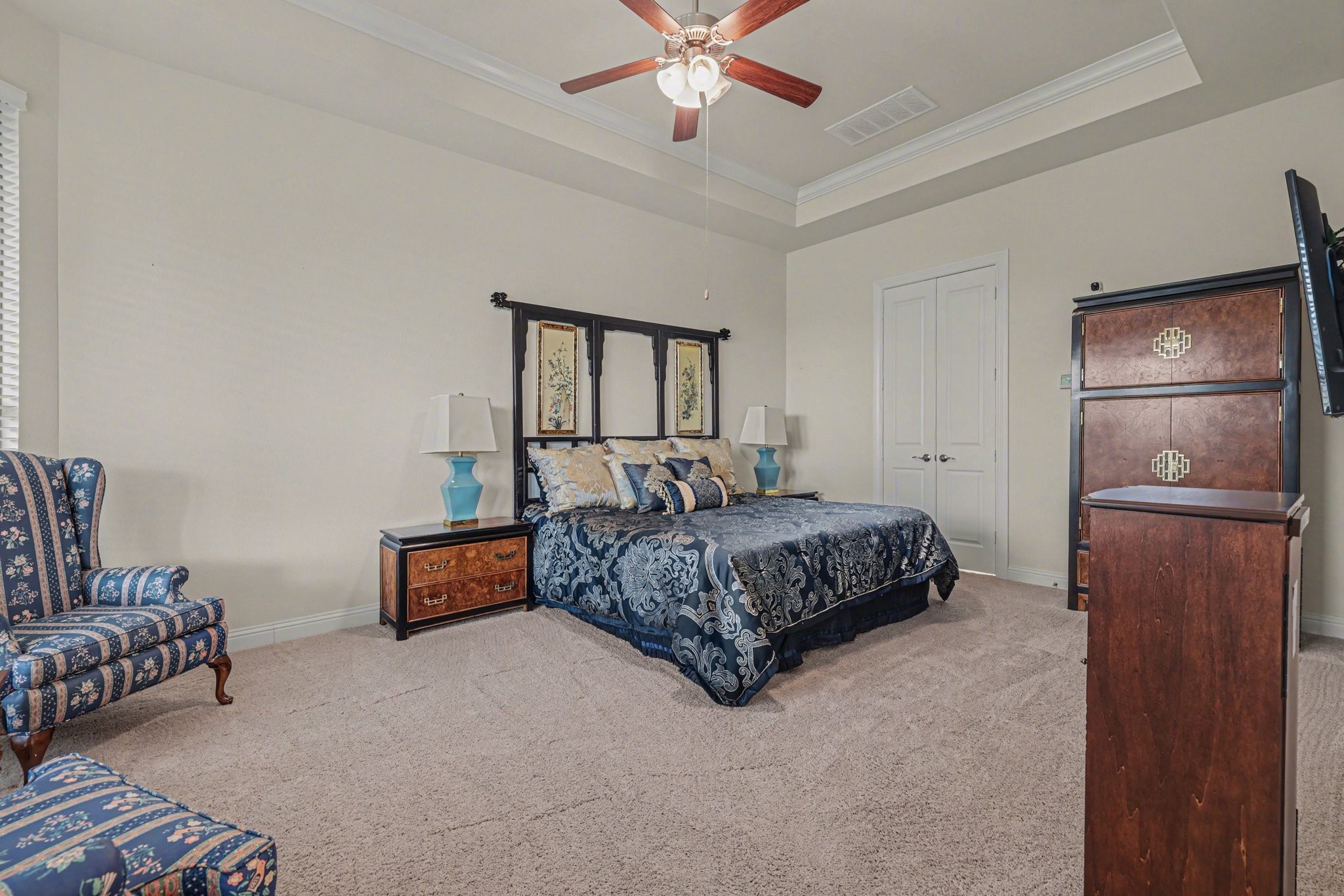 7434 Kearney Hill Lane Spring, TX 77389 - Photo 15 of 36 a bedroom with a bed and ceiling fan