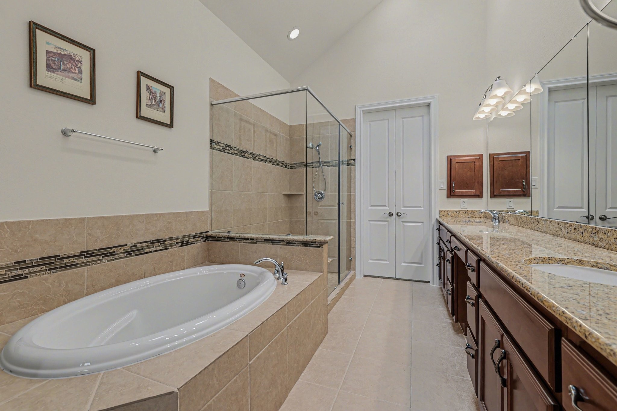 7434 Kearney Hill Lane Spring, TX 77389 - Photo 18 of 36 a spacious bathroom with a granite countertop tub sink a mirror and shower