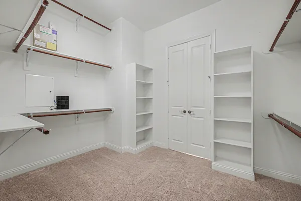 a view of an empty walk in closet