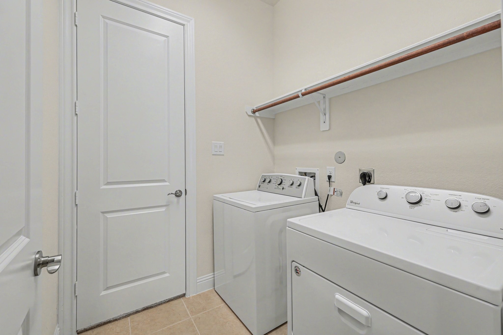 7434 Kearney Hill Lane Spring, TX 77389 - Photo 23 of 36 a view of storage and utility room with washer and dryer