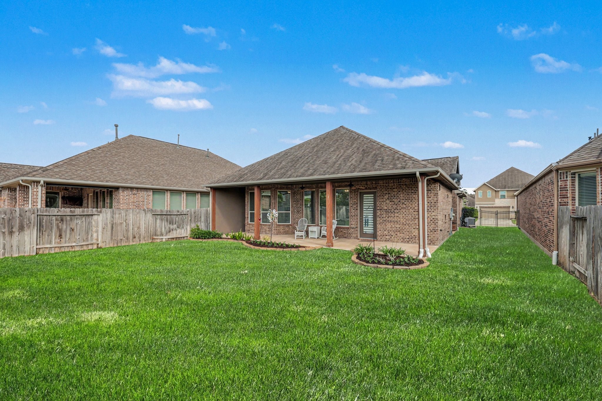 7434 Kearney Hill Lane Spring, TX 77389 - Photo 34 of 36 a front view of a house with a garden