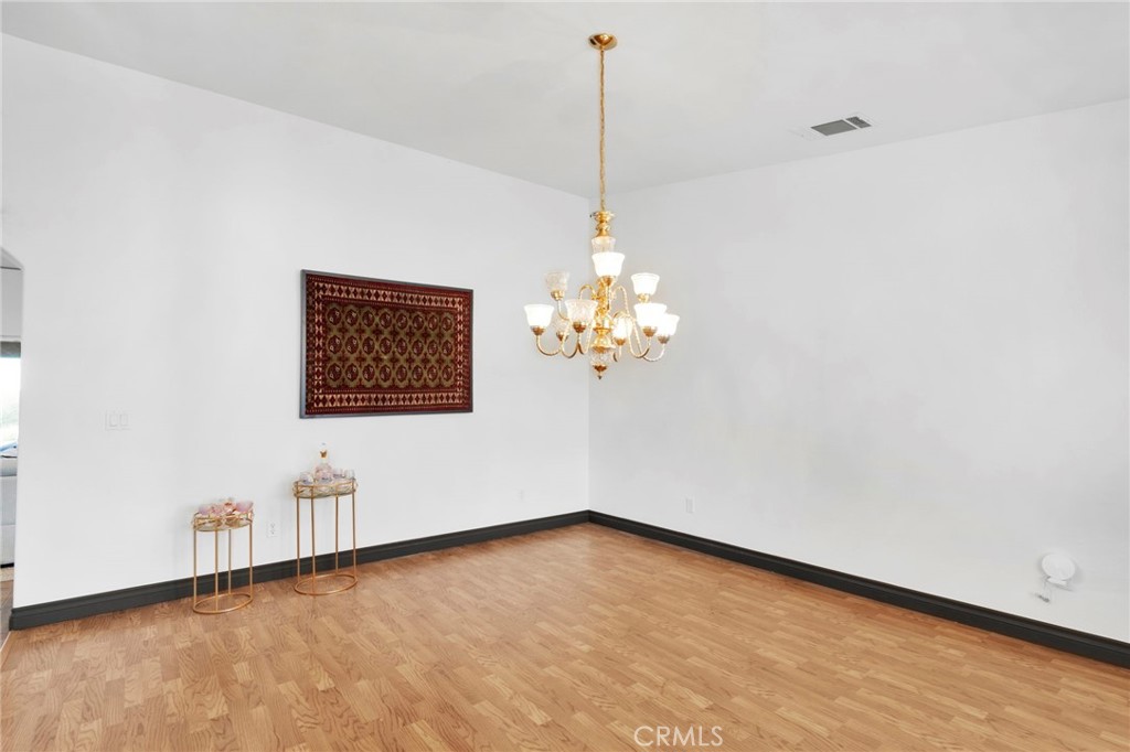 13724 Yuma Road Apple Valley, CA 92307 - Photo 11 of 75 a view of an empty room with chandelier fan