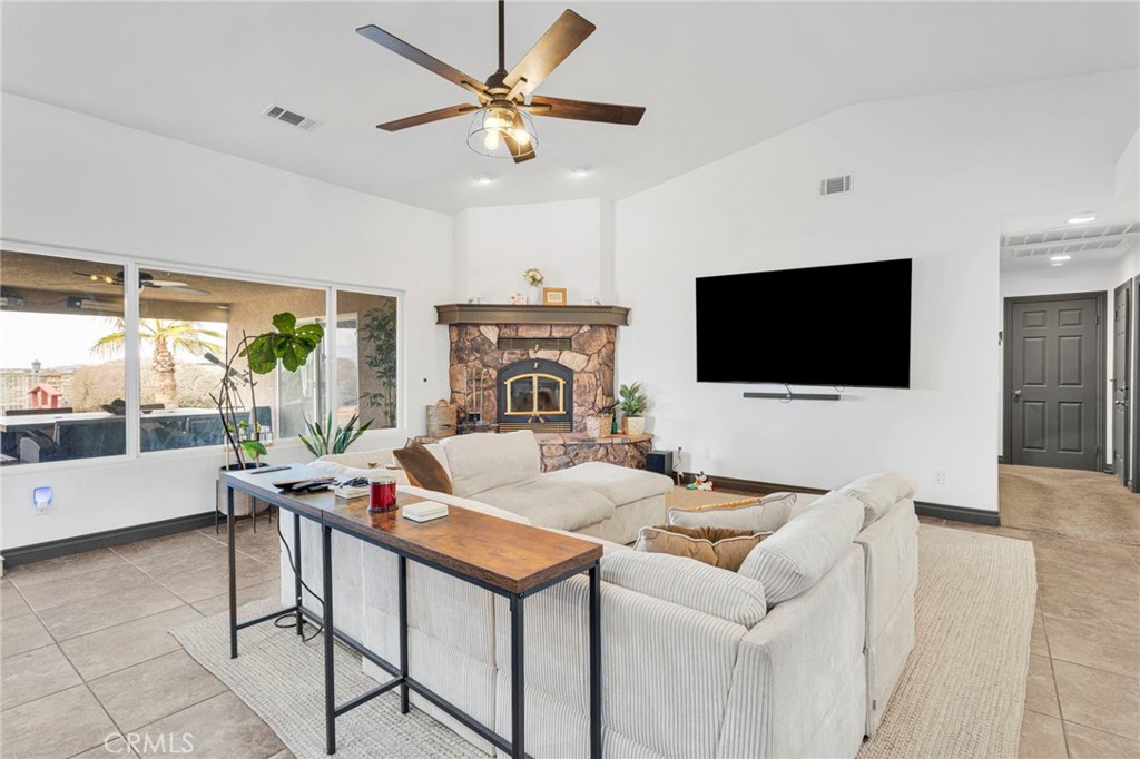 13724 Yuma Road Apple Valley, CA 92307 - Photo 14 of 75 a living room with furniture and a flat screen tv