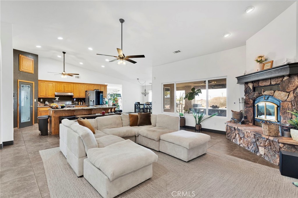 13724 Yuma Road Apple Valley, CA 92307 - Photo 15 of 75 a living room with furniture kitchen view and a large window