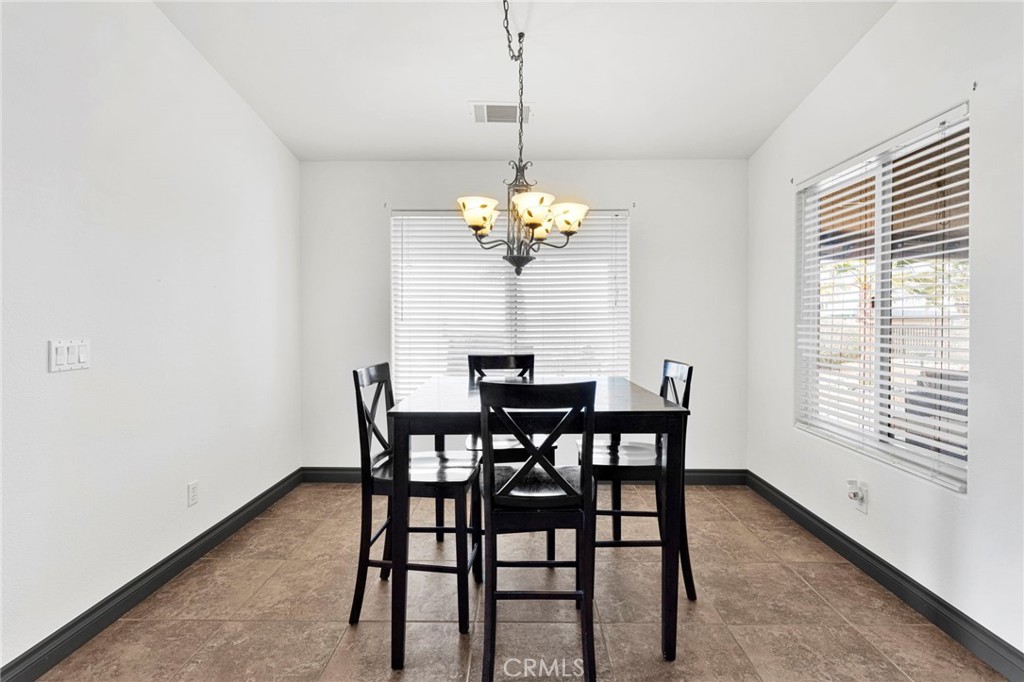 13724 Yuma Road Apple Valley, CA 92307 - Photo 21 of 75 a dining room with furniture and window
