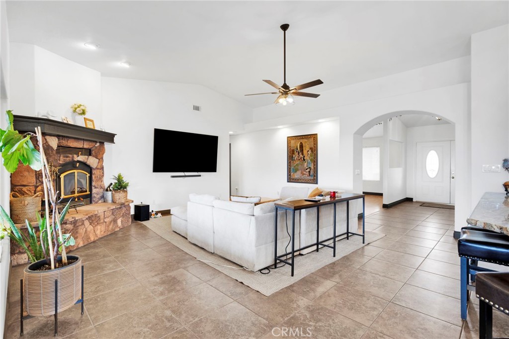 13724 Yuma Road Apple Valley, CA 92307 - Photo 22 of 75 a living room with furniture and a flat screen tv