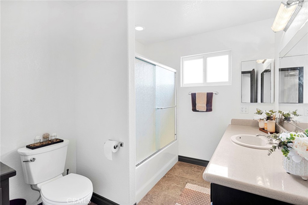 13724 Yuma Road Apple Valley, CA 92307 - Photo 29 of 75 a bathroom with a sink a toilet and shower