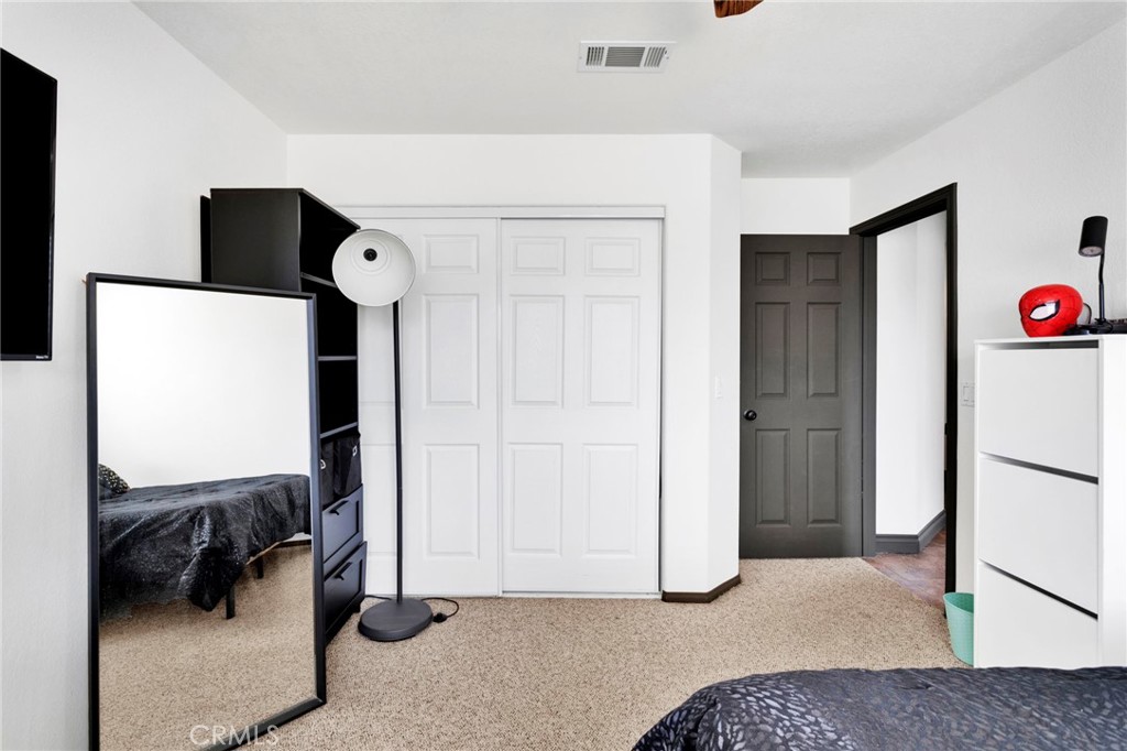 13724 Yuma Road Apple Valley, CA 92307 - Photo 33 of 75 a livingroom with a cabinet and a couch