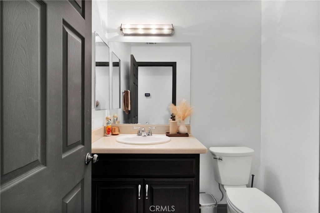 13724 Yuma Road Apple Valley, CA 92307 - Photo 46 of 75 a bathroom with a sink and a toilet