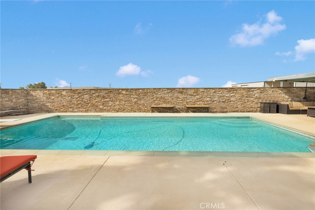 13724 Yuma Road Apple Valley, CA 92307 - Photo 61 of 75 a view of a yard with an outdoor space and seating area