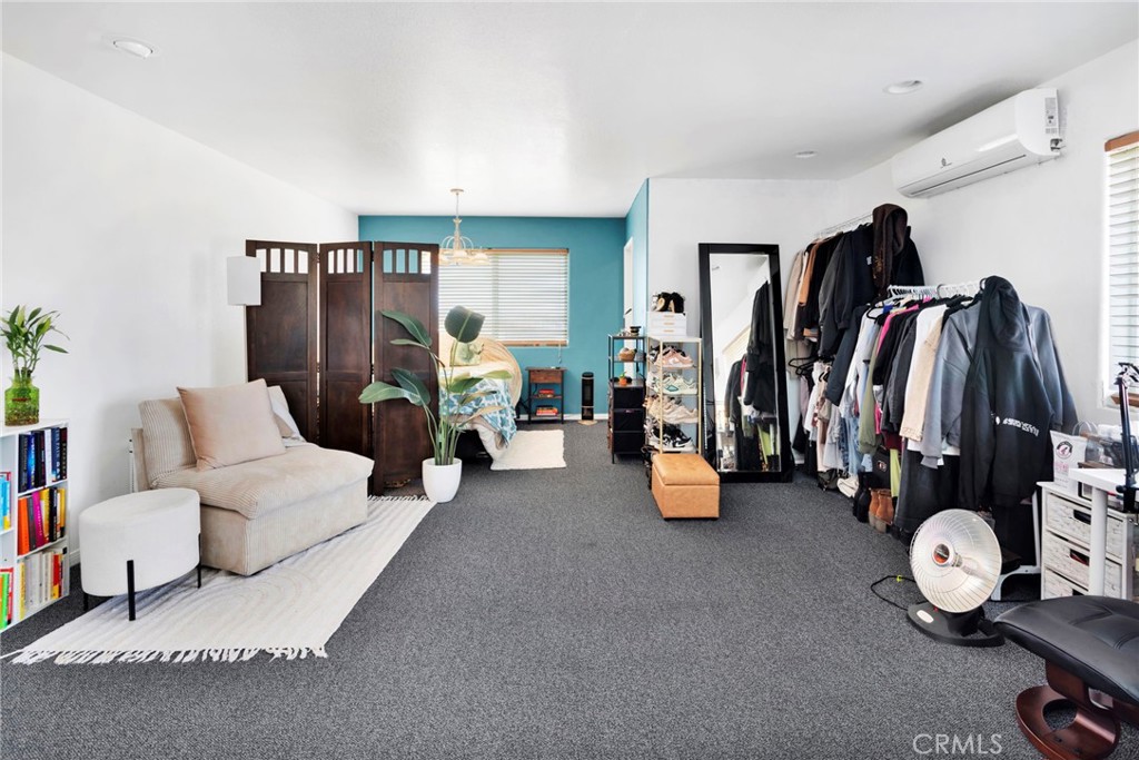 13724 Yuma Road Apple Valley, CA 92307 - Photo 68 of 75 a living room with furniture and a flat screen tv