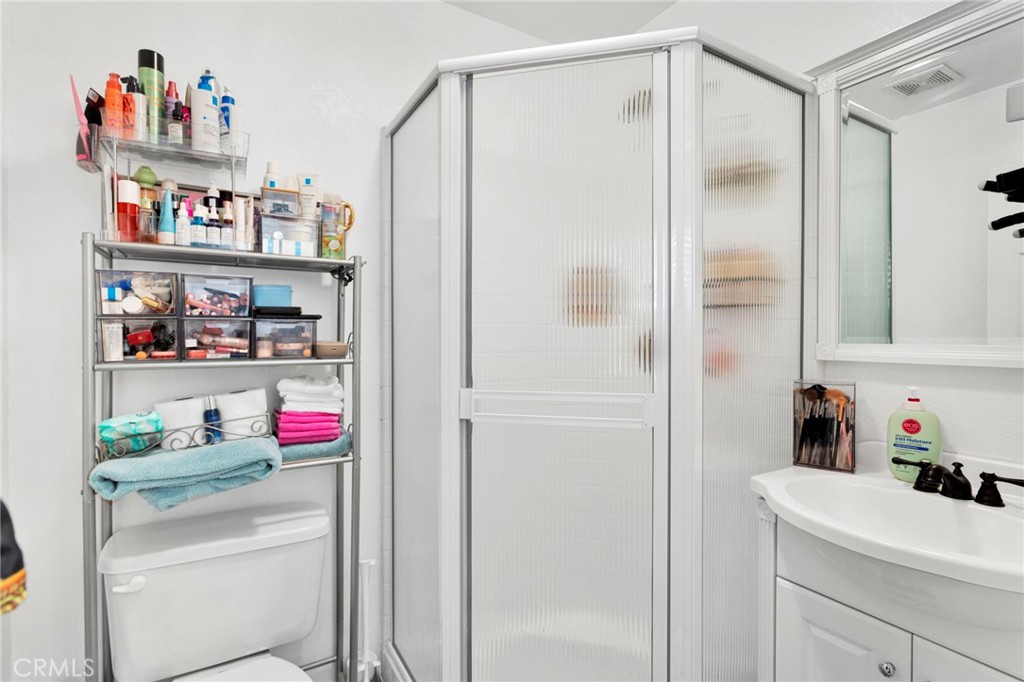 13724 Yuma Road Apple Valley, CA 92307 - Photo 70 of 75 a bathroom with a shower curtain and a closet