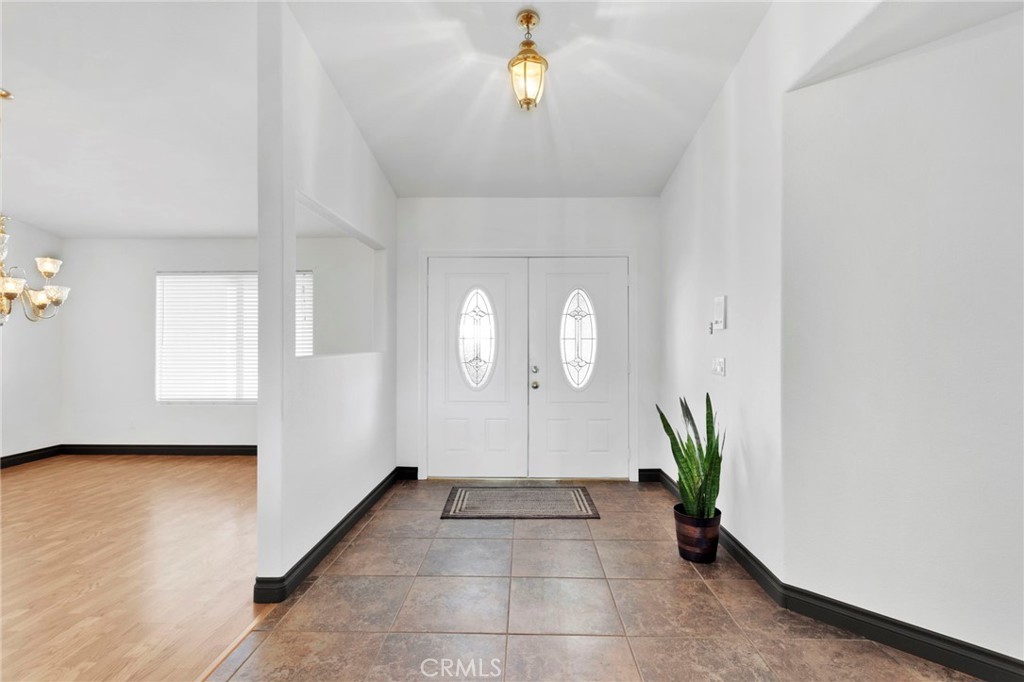 13724 Yuma Road Apple Valley, CA 92307 - Photo 8 of 75 a view of entryway with window and wooden floor